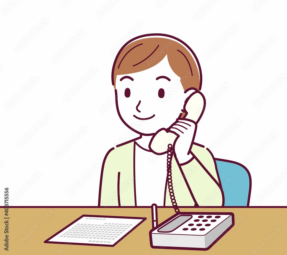 Young woman in a cardigan_Fixed-line phone Young woman in a cardigan_Fixed-line phone