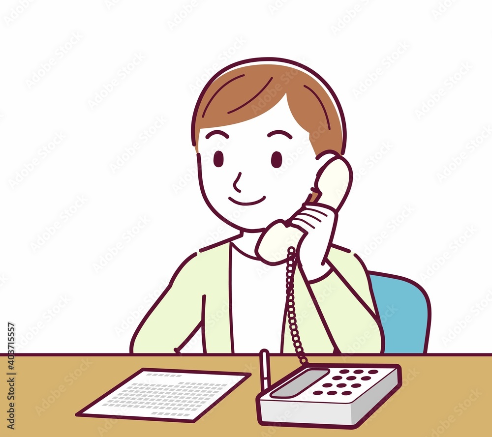 Young woman in a cardigan_Fixed-line phone Young woman in a cardigan_Fixed-line phone