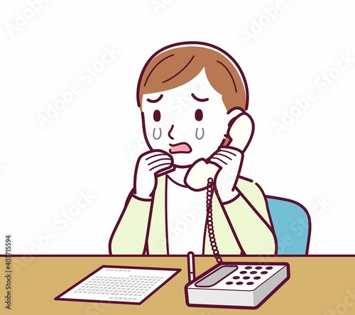 Young woman in a cardigan_Fixed-line phone