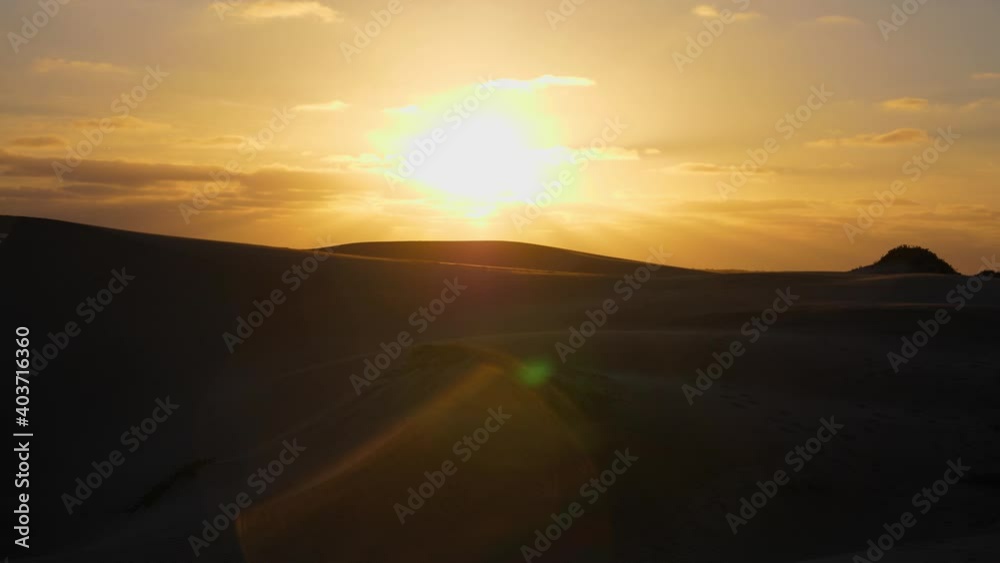 Establishing shot, sunlight reflecting in the lens of a camera, Scenic view of the Desert and sunrise in Adolfo Lopez Mateos Baja California sur, Mexico. Establishing shot, sunlight reflecting in the lens of a camera, Scenic view of the Desert and sunrise in Adolfo Lopez Mateos Baja California sur, Mexico.