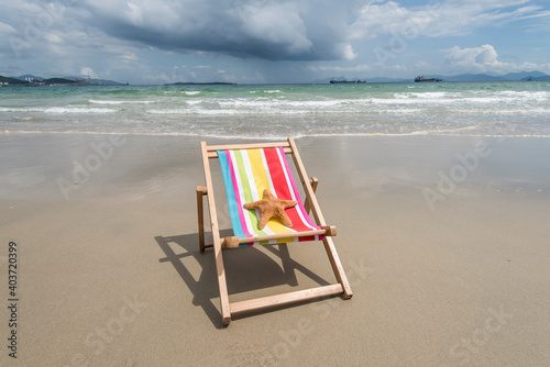 Fototapeta Naklejka Na Ścianę i Meble -  Deck chair at the tropical beach