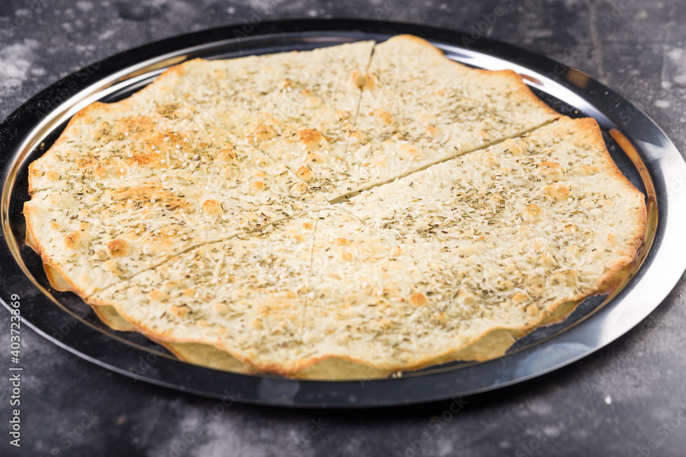 Focaccia with Mozzarella, Rosemary, Grated Parmesan Cheese, Butter, Greens, Basil. Focaccia with Mozzarella, Rosemary, Grated Parmesan Cheese, Butter, Greens, Basil.