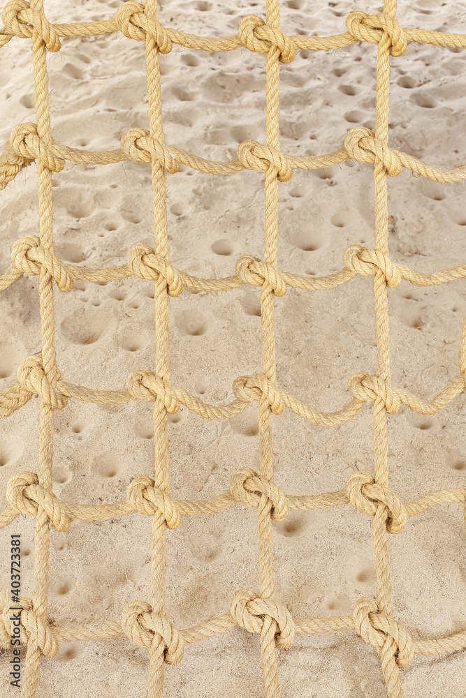 Rope mesh or Rope knot on sand in children playground attraction Rope mesh or Rope knot on sand in children playground attraction