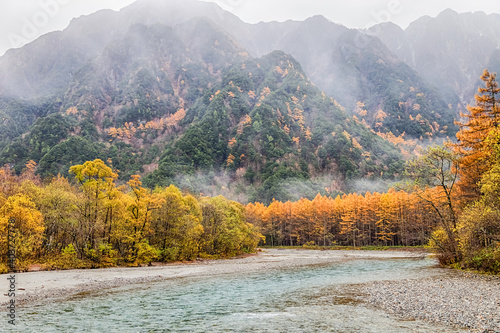 Kamikochi National Park in the Northern Japan Alps of Nagano Prefecture, Japan. Beautiful mountain in autumn leaf with river.