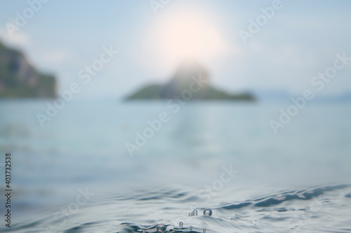 Sunset texture background blur , mountain background in the sea, sunlight and blue
