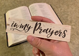 In My Prayers Sign Above a Bible
