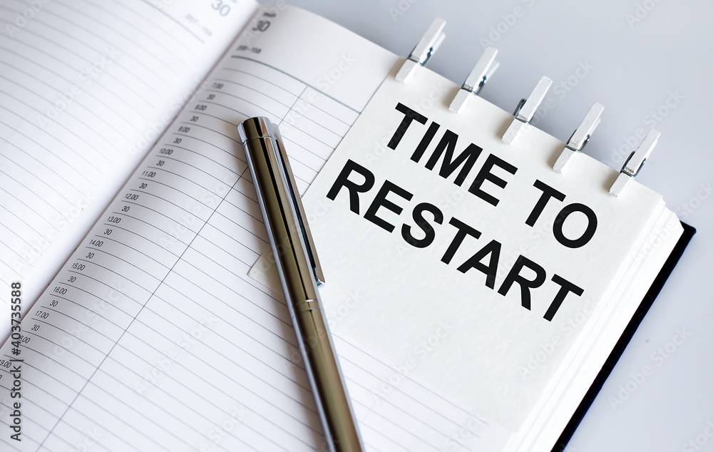 text TIME TO RESTART on the short note texture background with pen text TIME TO RESTART on the short note texture background with pen