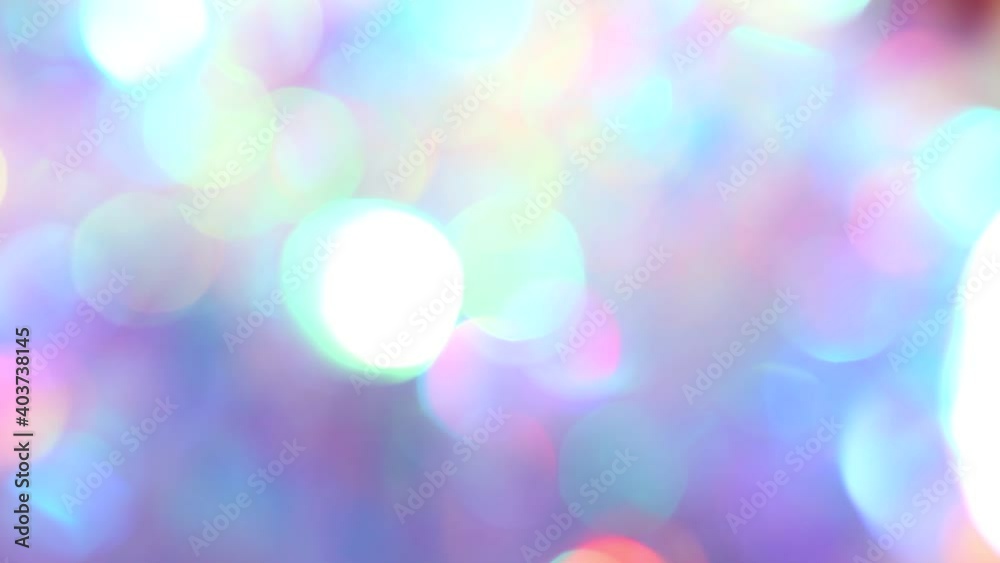 Soft pastel neon pink blue purple silver crystal lights bokeh. Luxury background for party. Blurred holographic holiday lights