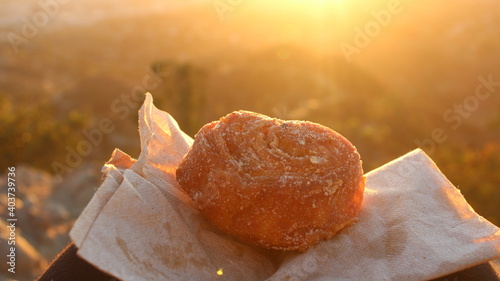 Eat a donut at sunset