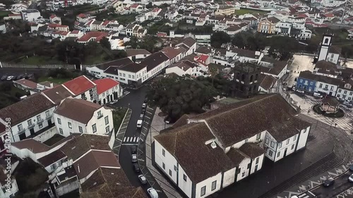 Portugal Sao Miguel Ribeira Grande Igreja Matriz de Nossa Senhora da Estrela drone shot aerial look view from above slow fly towards cloudy day birds photo