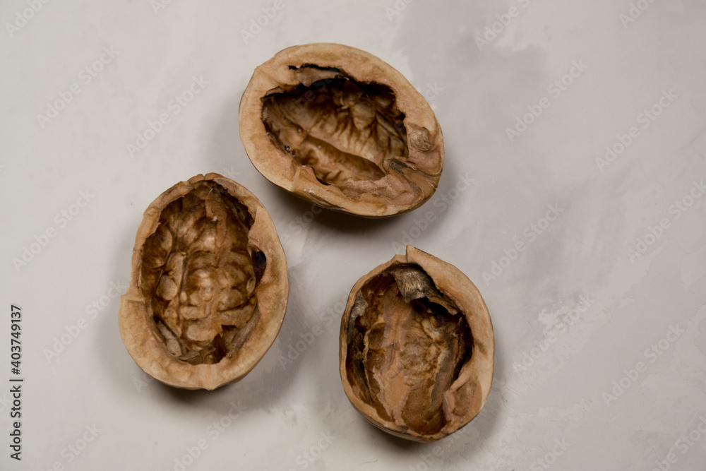 Chopped nuts on a neutral gray background, nutshells Chopped nuts on a neutral gray background, nutshells