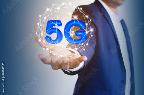 5 G letters on the hand of businessmen The concept of a high-speed Internet communication network Business communication