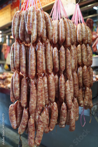 Chinese fresh meat delicacies, sausages in food market.