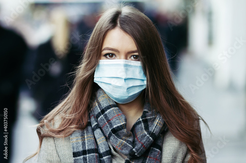 Woman in respiratory mask, closeup portrait. Influenza, quarantine, coronavirus covid-19