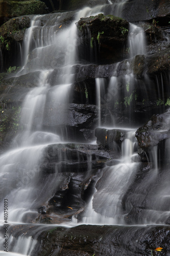 Rocky waterfall view with heavy flow. © AlexandraDaryl