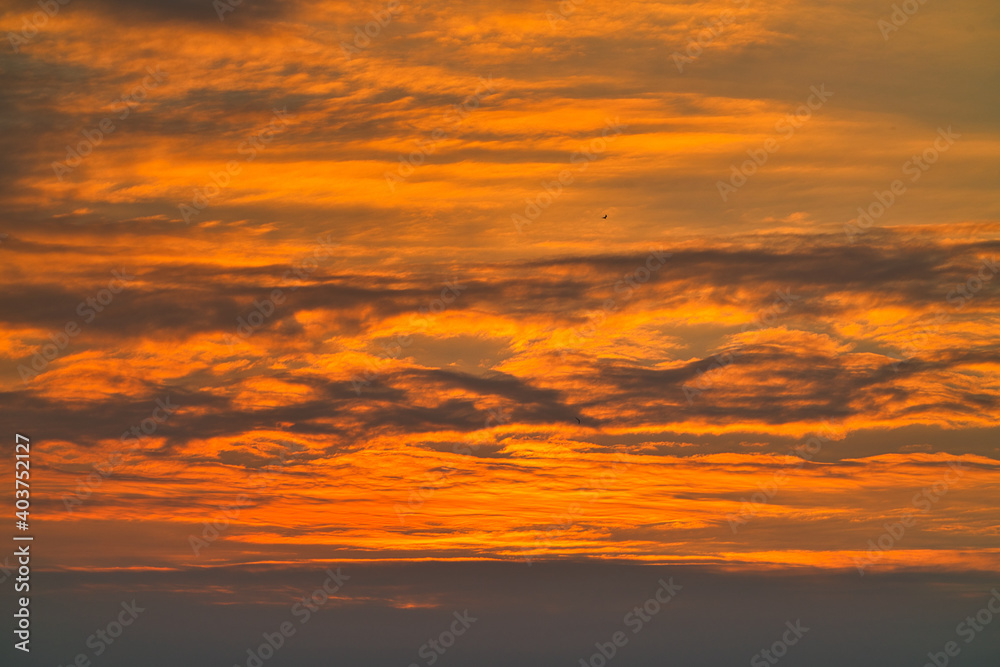 Sunset sky and clouds. Fantastic landscape with sunset. This texture is suitable for background or material.
