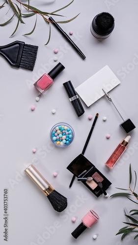 Vertical banner. Cosmetics and fashion blogger background. Flat lay. Makeup, accessories on a light background. Top view shot.