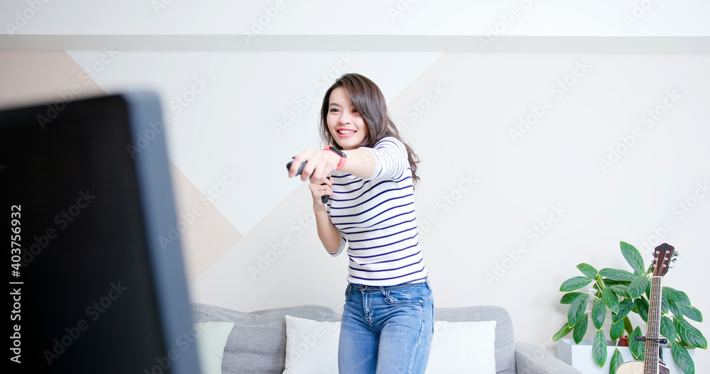 woman play motion sensing game woman play motion sensing game