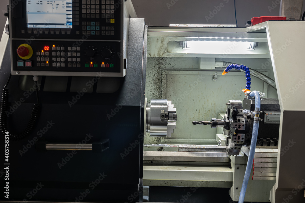 Cnc machine. The CNC lathe machine or Turning machine. Turning numerical control machine with tools and chuck.