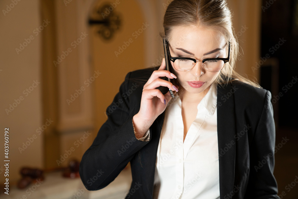 Young female lawyer during work in chamber. Young female lawyer during work in chamber.