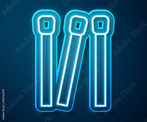 Glowing neon line Matches icon isolated on blue background. Vector.