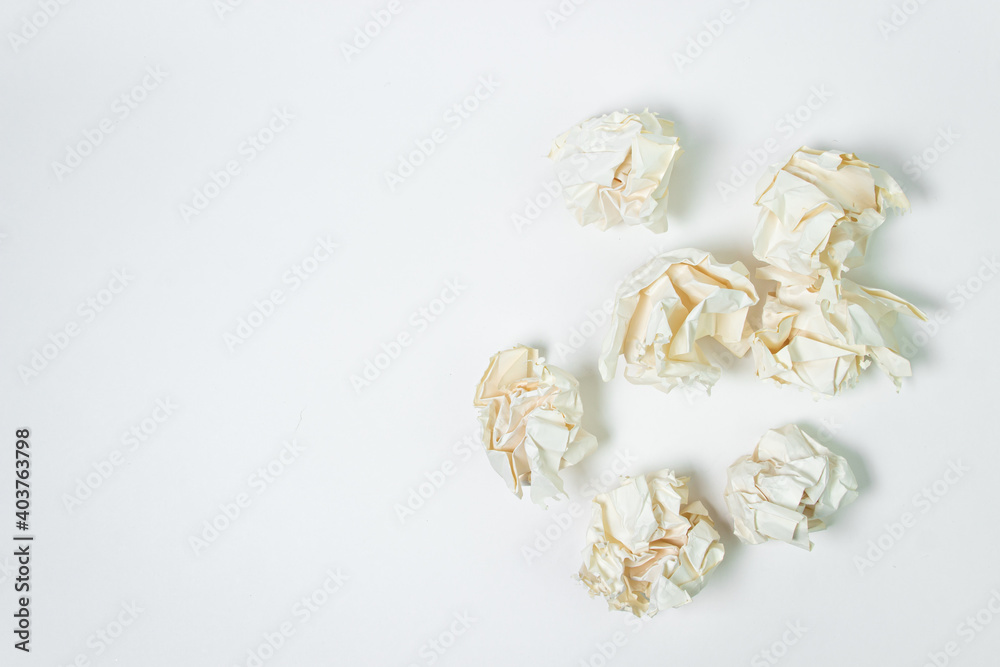 Crumpled paper on a white background. A pile of crumpled paper. Creative crisis. Lack of ideas Crumpled paper on a white background. A pile of crumpled paper. Creative crisis. Lack of ideas