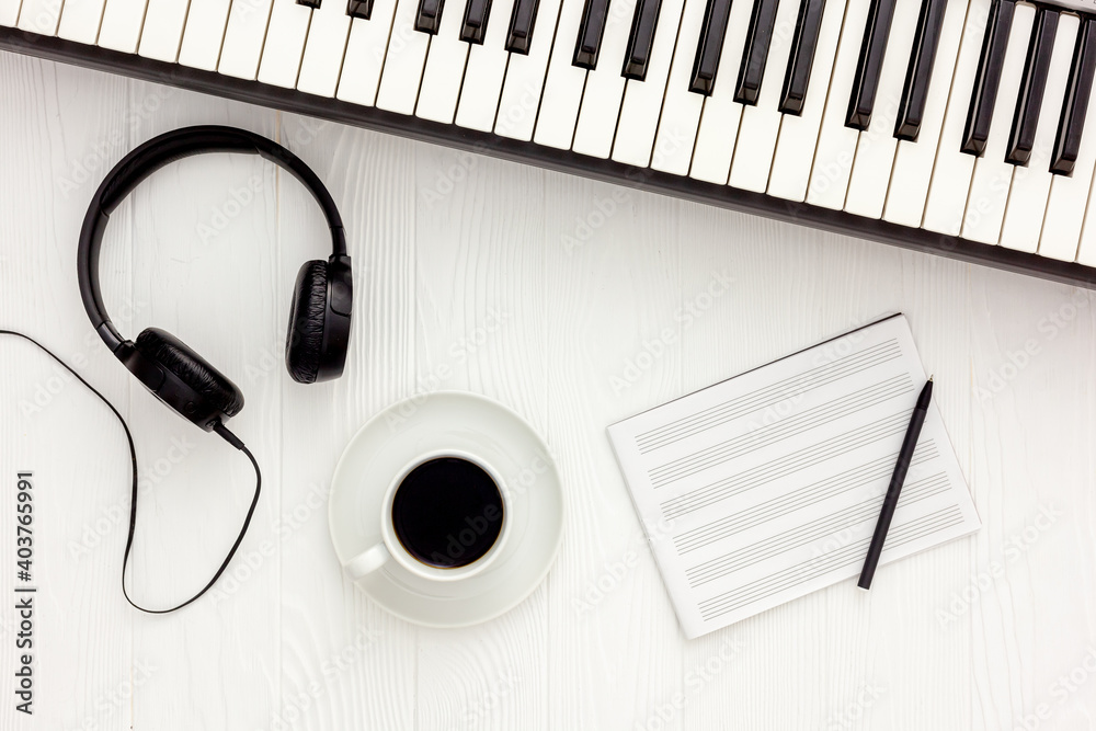 songwriter or dj work place with synthesizer and headphones