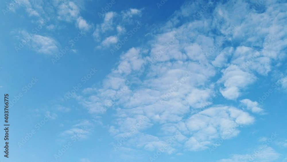 Time lapse clip of white fluffy clouds over blue sky, Flight over clouds, loop-able, cloudscape, day, sunny beautiful clean weather, soft colour skies with cloudscape Time lapse clip of white fluffy clouds over blue sky, Flight over clouds, loop-able, cloudscape, day, sunny beautiful clean weather, soft colour skies with cloudscape