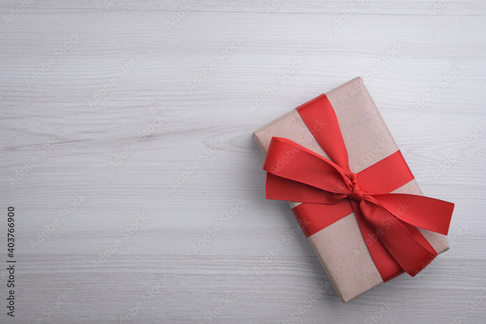 Background for Valentine's Day greeting card.Valentines day concept.Red gift ribbons, gifts, hearts on a wooden background. Top view Background for Valentine's Day greeting card.Valentines day concept.Red gift ribbons, gifts, hearts on a wooden background. Top view