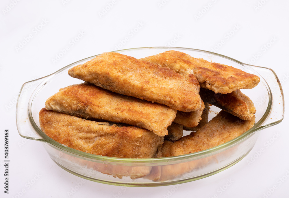 Breaded fish fillets in a glass, heat-resistant dish Breaded fish fillets in a glass, heat-resistant dish