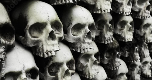 a pile of skulls stacked one on top of another, a wall of human skulls, dark mystical conceptual with glitches and color change effects, film negative effect, glitch