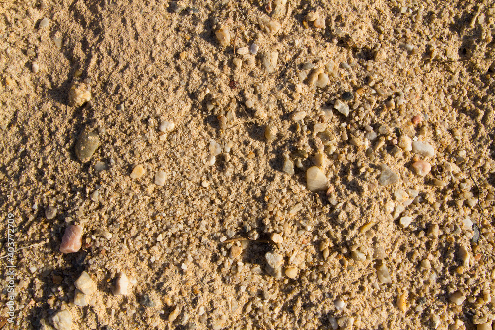 Extreme macro close up of fine beach sand surface pattern in the summer. Sandy trails, texture and background. Top view. Abstract Background. Extreme macro close up of fine beach sand surface pattern in the summer. Sandy trails, texture and background. Top view. Abstract Background.