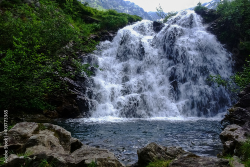 gorgeous wide waterfall with a basin while hiking