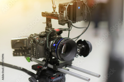 Professional video camera, lights and equipment all set up for an interview in a studio setting.