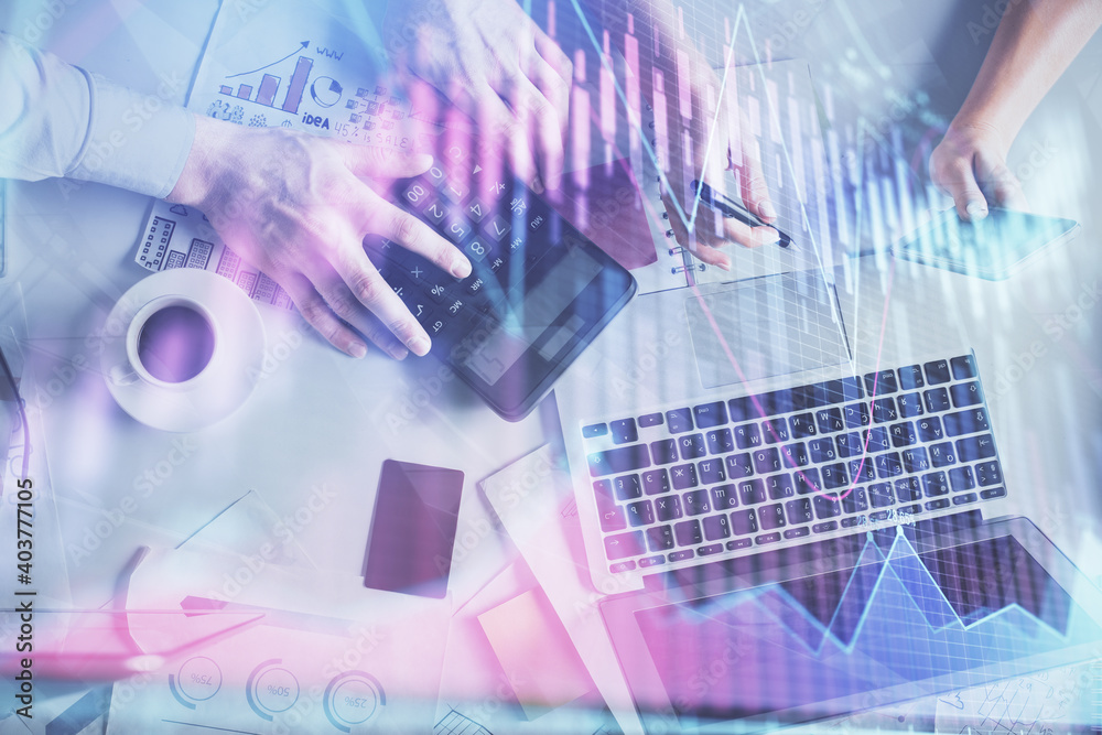 Double exposure of man and woman working together and financial chart hologram drawing. market analysis concept. Computer background. Top View. Double exposure of man and woman working together and financial chart hologram drawing. market analysis concept. Computer background. Top View.