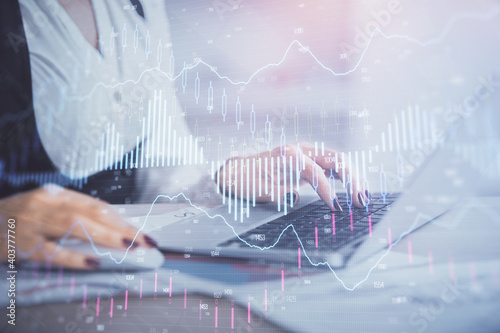 Wallpaper Mural Double exposure of businesswoman hands typing on computer and forex graph hologram drawing. Financial analysis concept. Torontodigital.ca