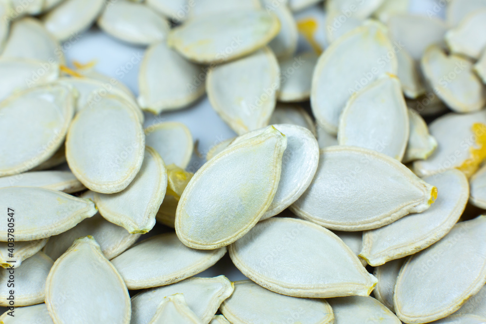 Fresh Pumpkin seeds background. Close up shot.