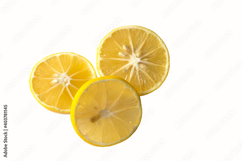 Three slices of lemon on a white background. Three slices of lemon on a white background.