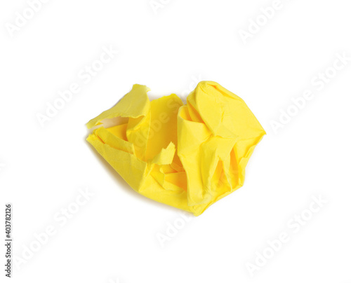 crumpled ball of brown sheet of yellow paper isolated on white background