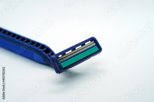 Selective focus on shaving razor blade isolated with white background.