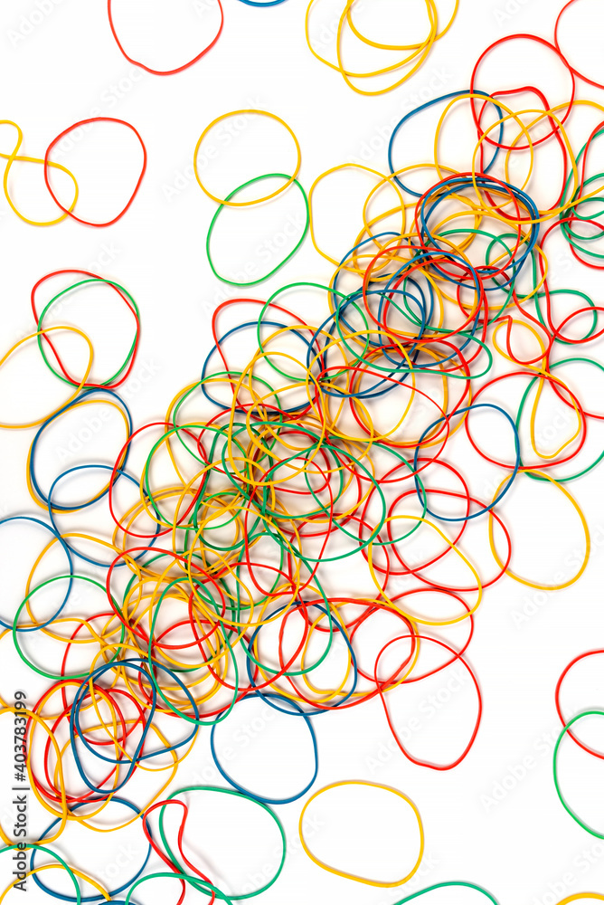 Colored stationery elastic bands on a white background. Colored stationery elastic bands on a white background.
