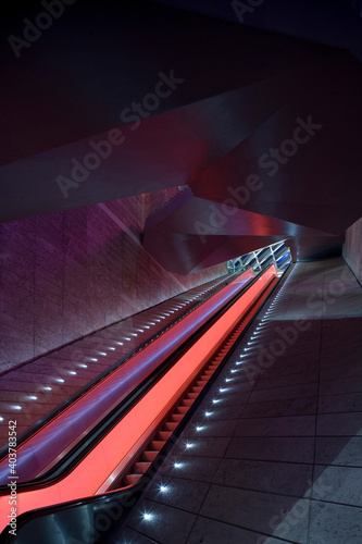 Lit escalator in a public building