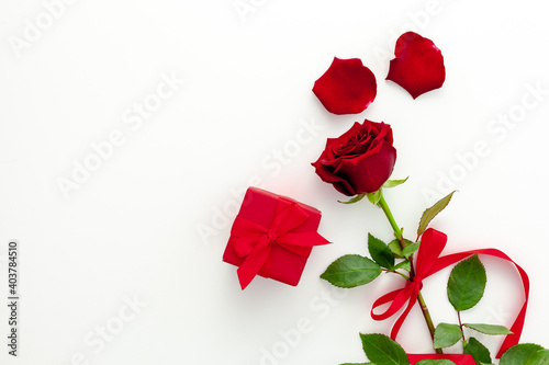 Fototapeta Naklejka Na Ścianę i Meble -  Valentine's Day. Red rose with a ribbon, love letter and red box.