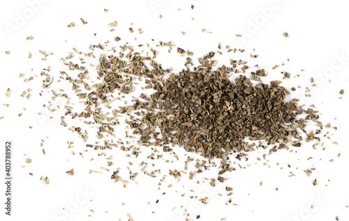 Dried and chopped basil spice pile isolated on white background, top view