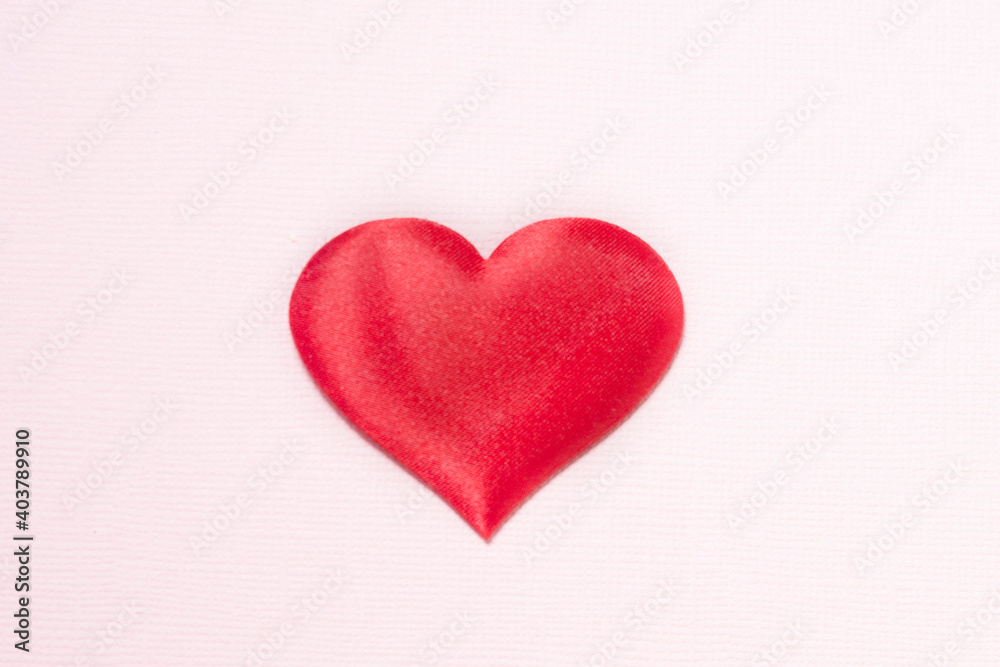 Heart on a pink background. The heart is located in the center..