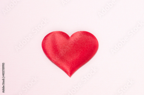 Heart on a pink background. The heart is located in the center..