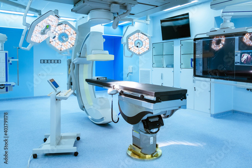 equipment in hospital, Equipment and medical devices in hybrid operating room blue filter , Surgical procedures , the operating room of the Future photo