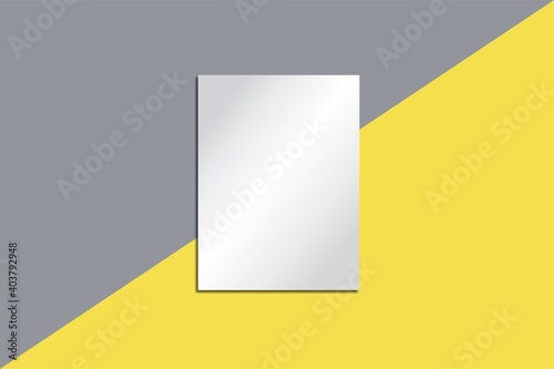 A white poster on wall divided diagonally in yellow and gray. Illuminating and Ultimate Gray is the color of the year. Blank canvas for design on yellow-gray background. 3d texture. space for text