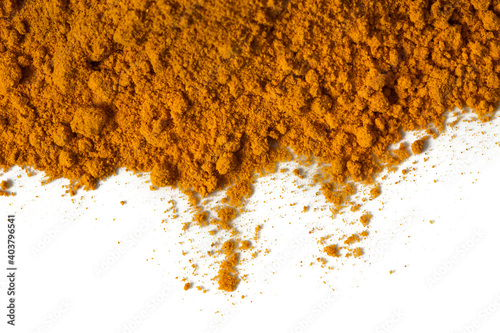 Heap of turmeric powder spice isolated on a white background. Top view. Heap of turmeric powder spice isolated on a white background. Top view.