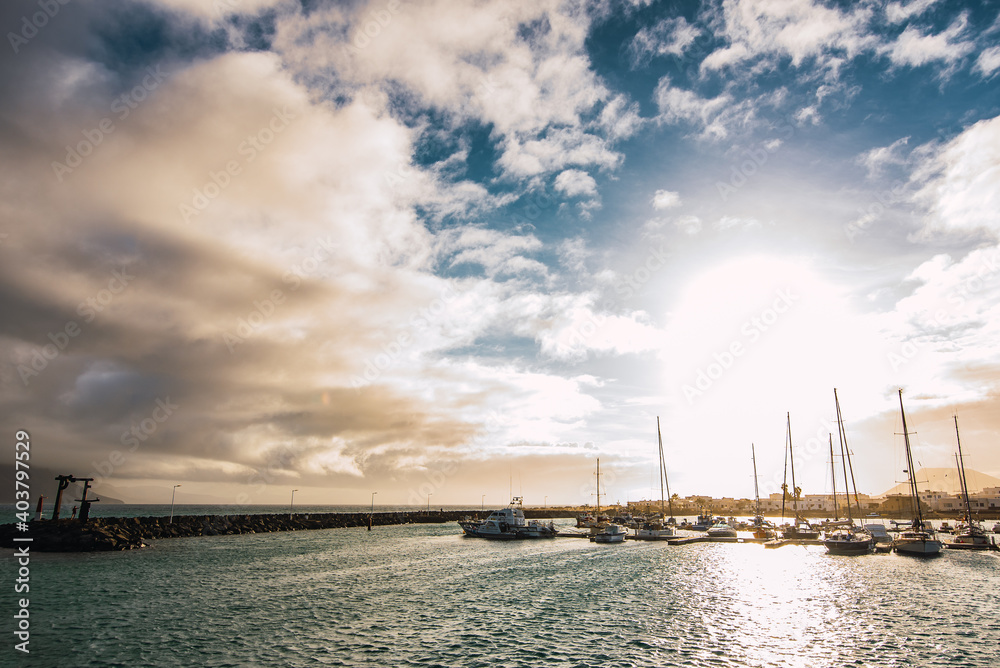 Port of Caleta del Sebo at sunset seen from the sea